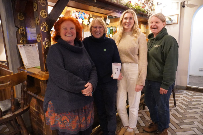 Sarah, Linda, Becky and Katherine standing in a pub