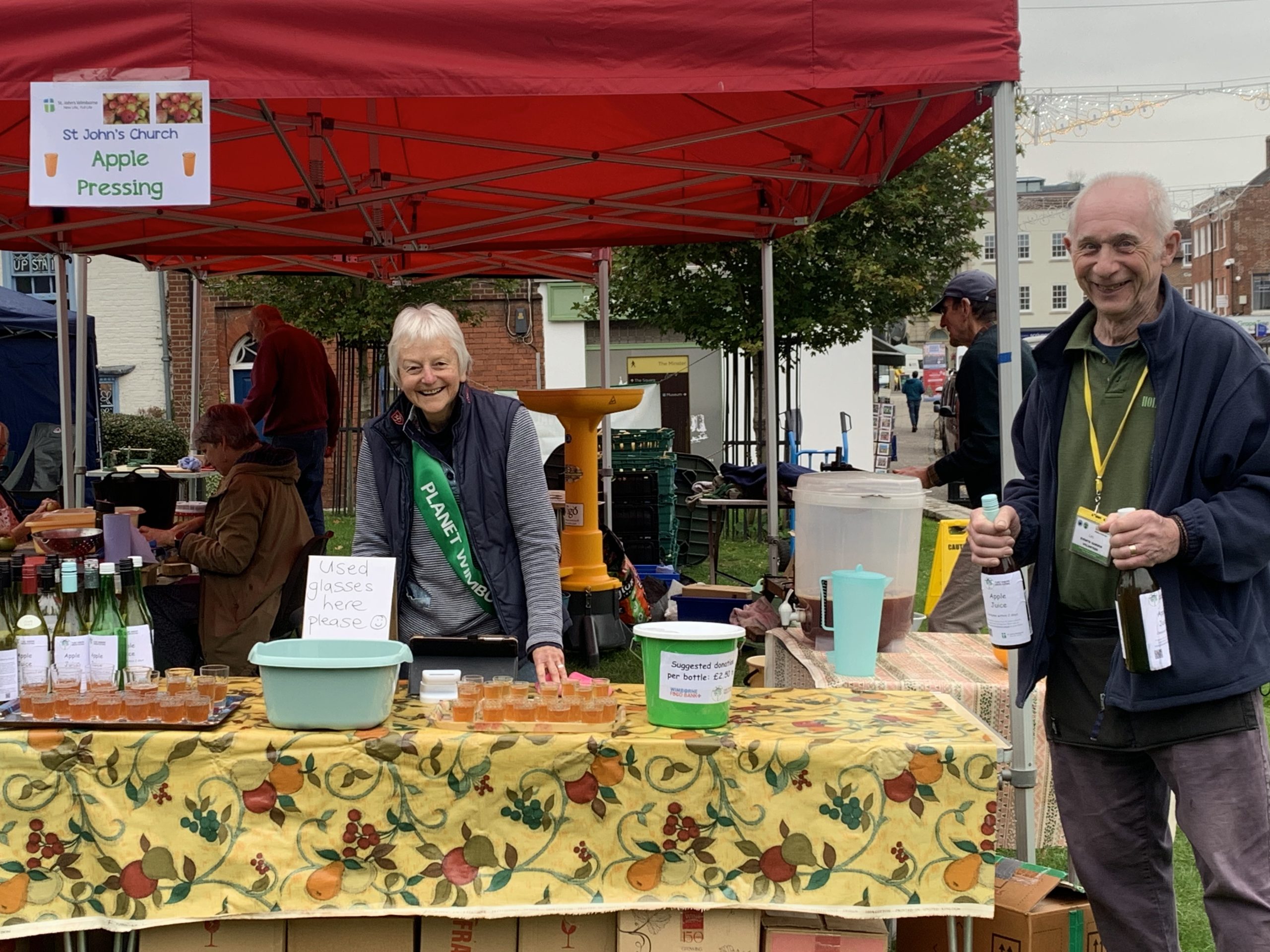 People at the St Johns Church apple pressing stand