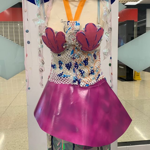 Dress made from waste materials and CDs